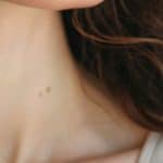 Hypothyroidism and thyroiditis fertility support - Dr. Marissa Gaucher Close-up of a woman’s neck for a blog about hypothyroidism, thyroiditis, and fertility support in BC.