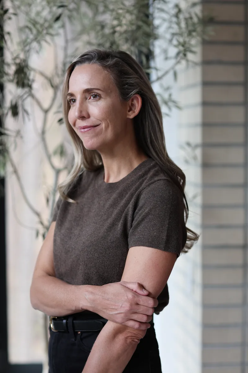 Dr. Marissa Gaucher beside a window and plant - Dr. Marissa Gaucher Dr. Marissa Gaucher beside a window and plant