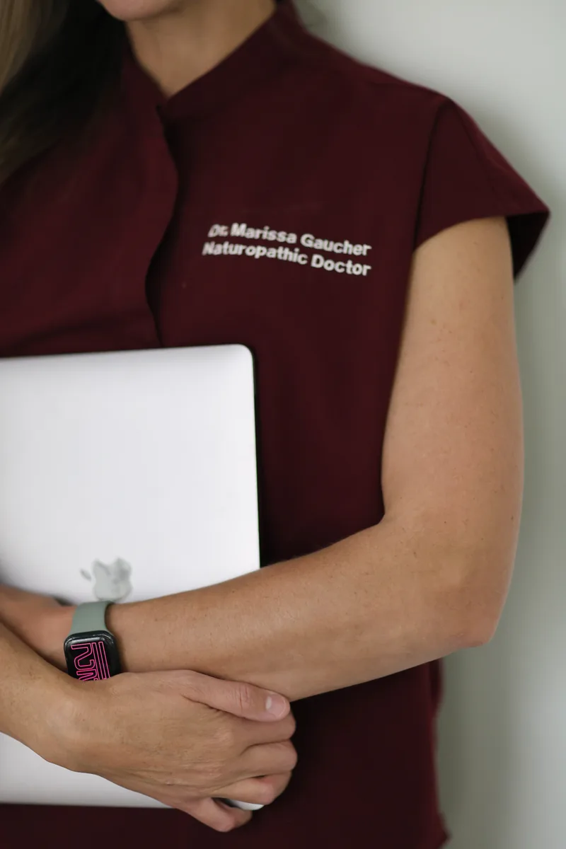 Dr. Marissa Gaucher holding a tablet in clinic - Dr. Marissa Gaucher Dr. Marissa Gaucher holding a tablet in clinic